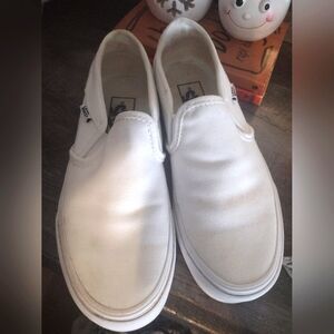 White slip on vans.
